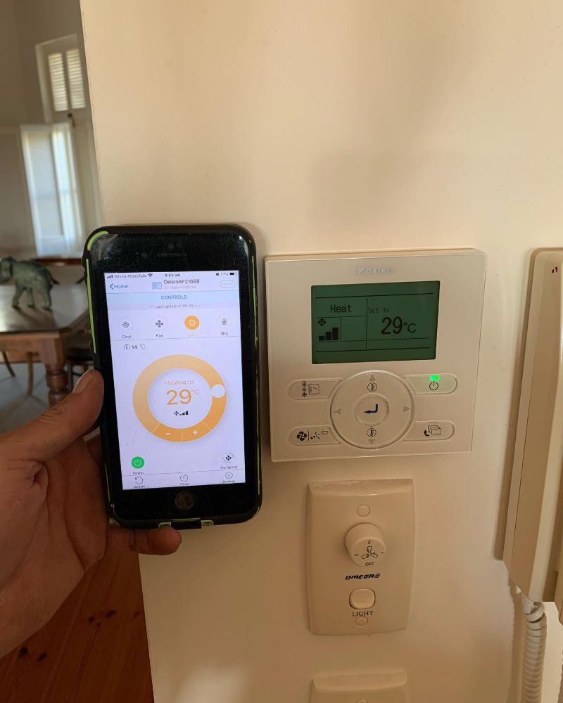 Phone app and wall controller both showing heating set to 29 degrees