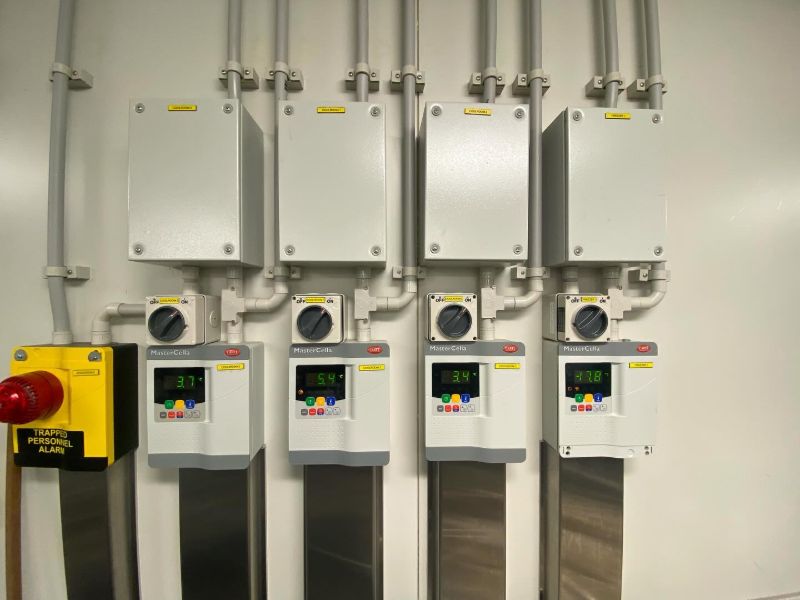 Four cool room temperature controllers beside a trapped personnel alarm