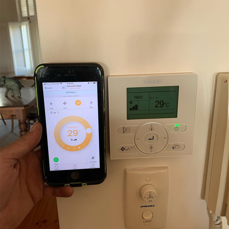 Phone app and wall controller both showing heating set to 29 degrees