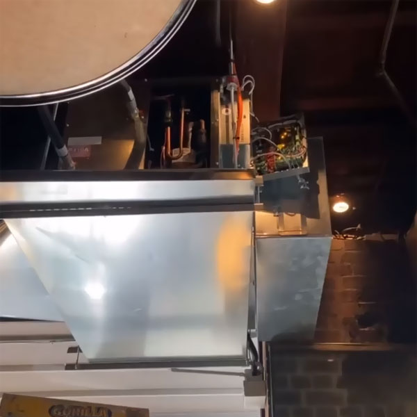 Galvanised ductwork with copper pipework and controls in a ceiling space